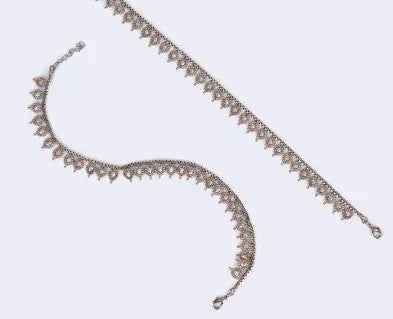 Traditional oval and flower design gold plated