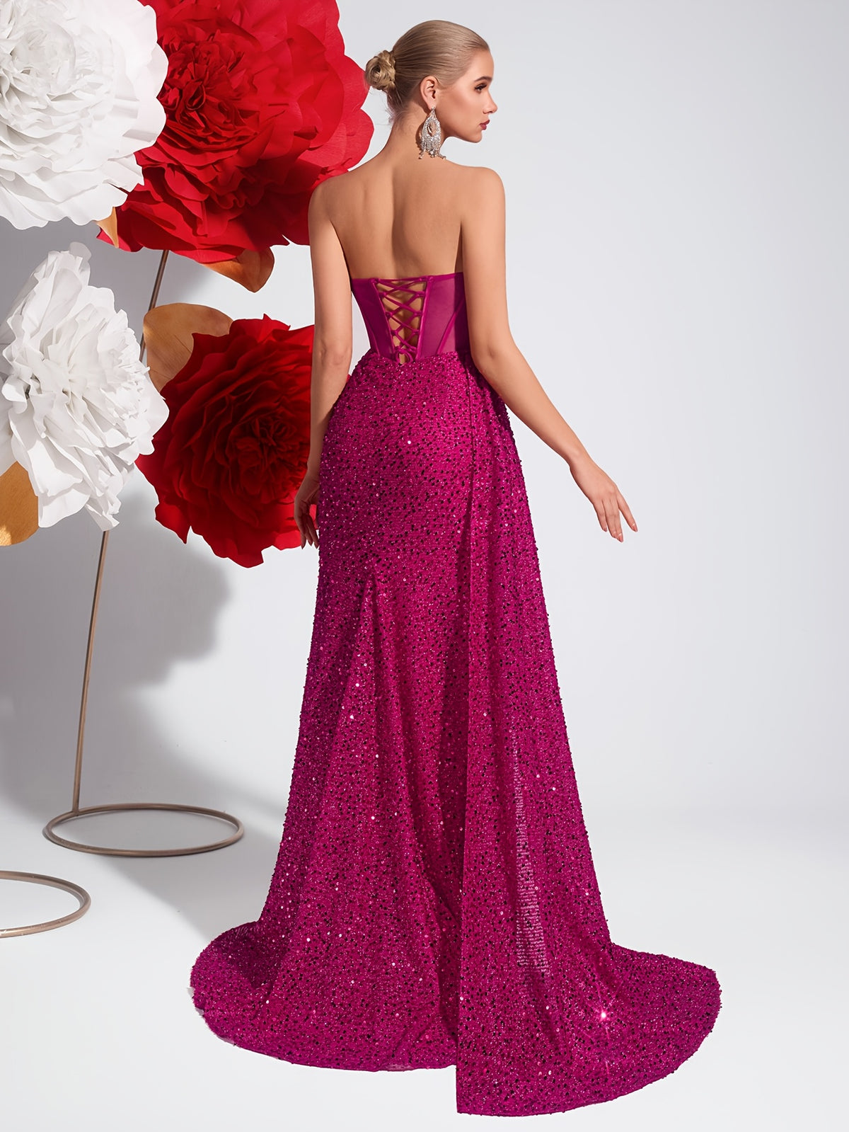 Strapless Sequin Evening Gown with Cut-Out Details and Flowing Ribbons