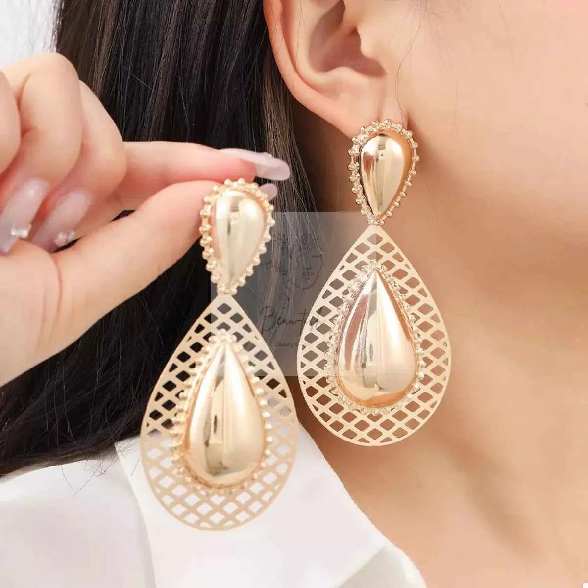 Hollowed - Out Teardrop Statement Earrings