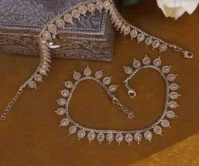 Traditional oval and flower design gold plated