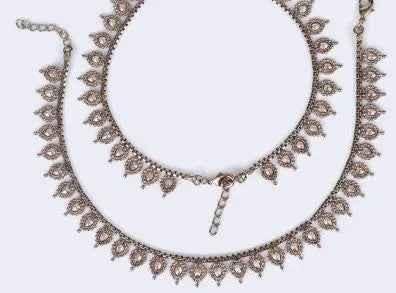 Traditional oval and flower design gold plated